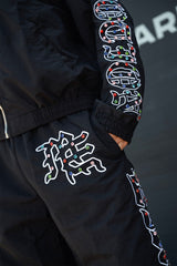 MIXED EMOTION Side Letter Graphic Elastic Waist Track Pants Unisex Streetwear